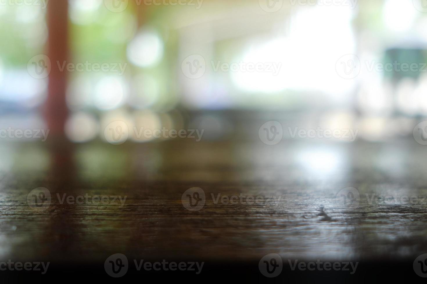 Close up Surface of Old Wooden Table in Cafe with Bokeh Background. photo