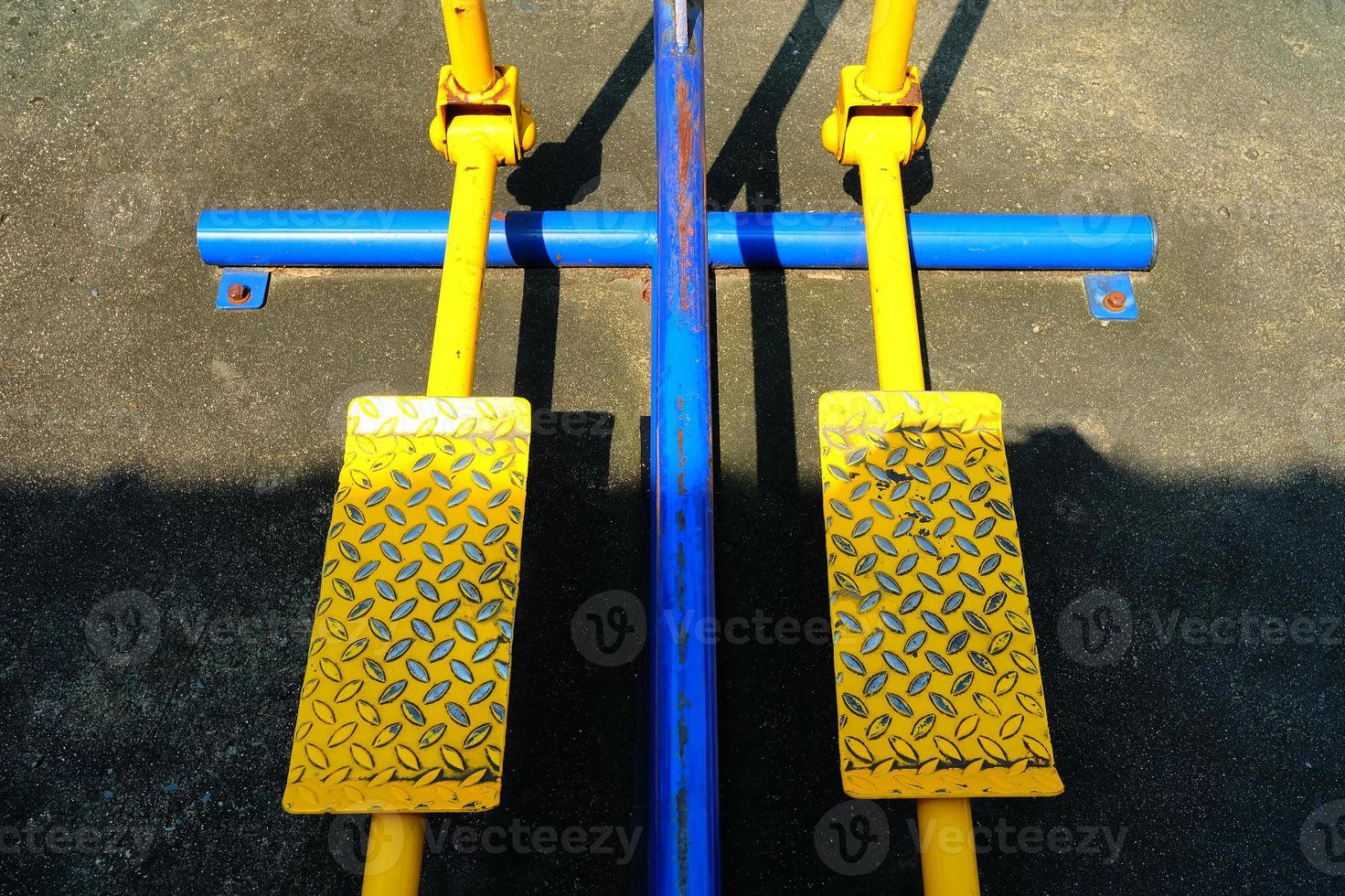 Close up Yellow Pedal of Leg Swings Exercise Machine. 21486003 Stock