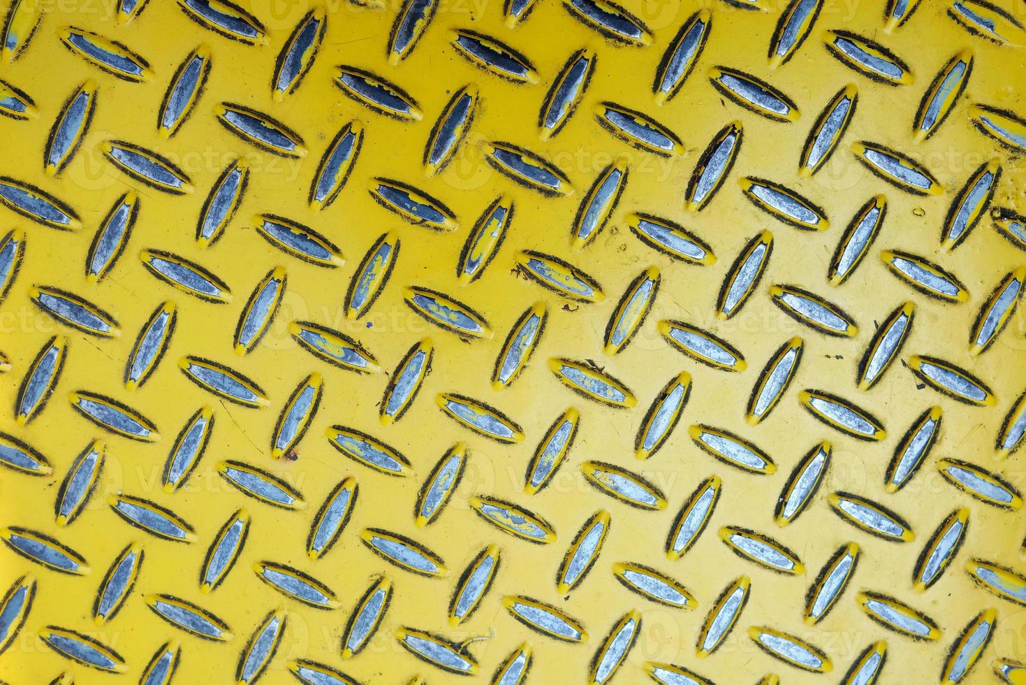 Close up Old Yellow Diamond Metal Plate. photo