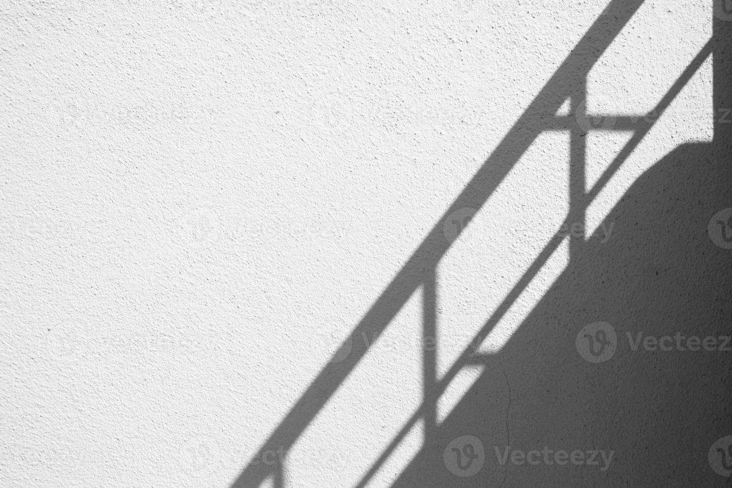 Banister Shadow on White Concrete Wall Texture Background in Minimal Concept. photo