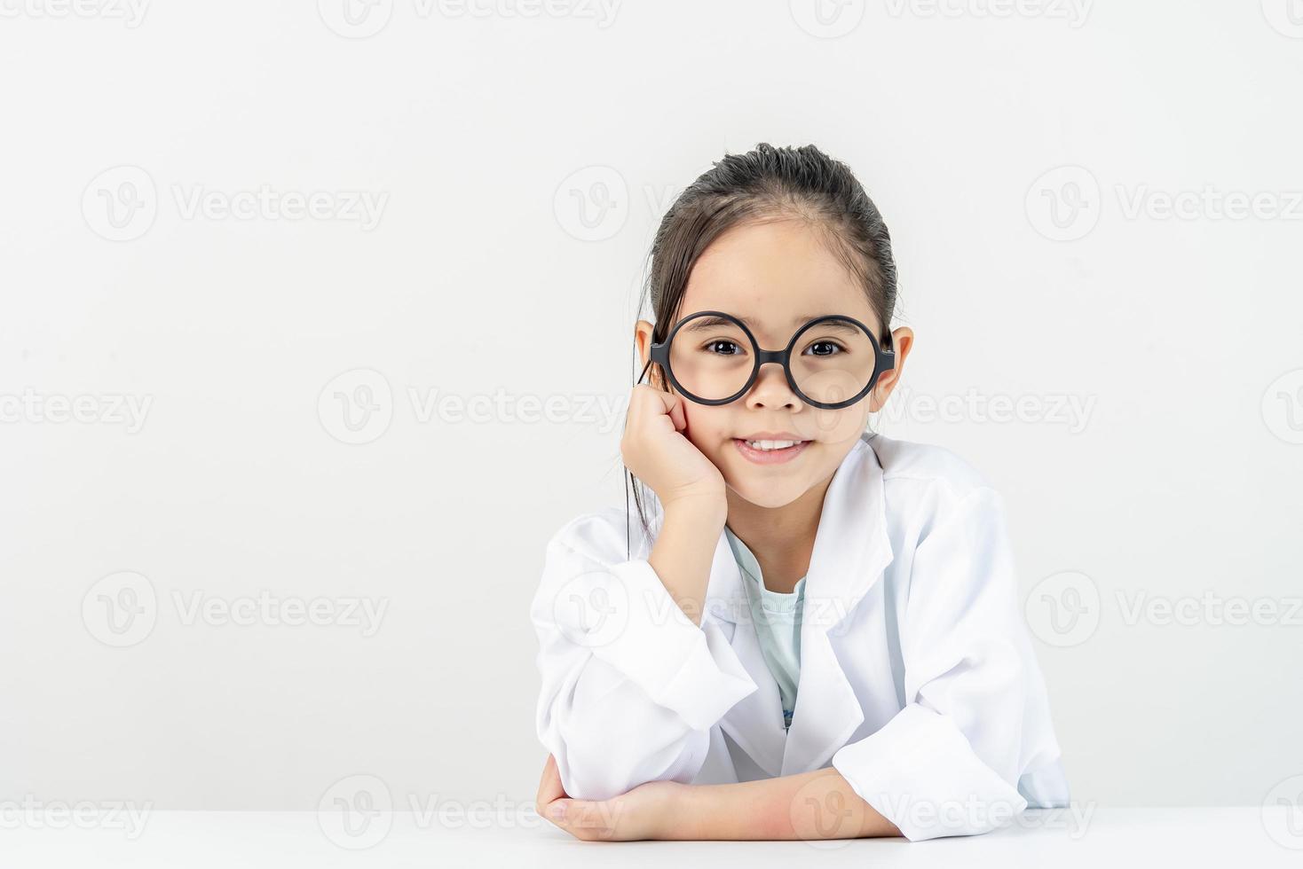 smart doctor Little Girl with white medical coat photo