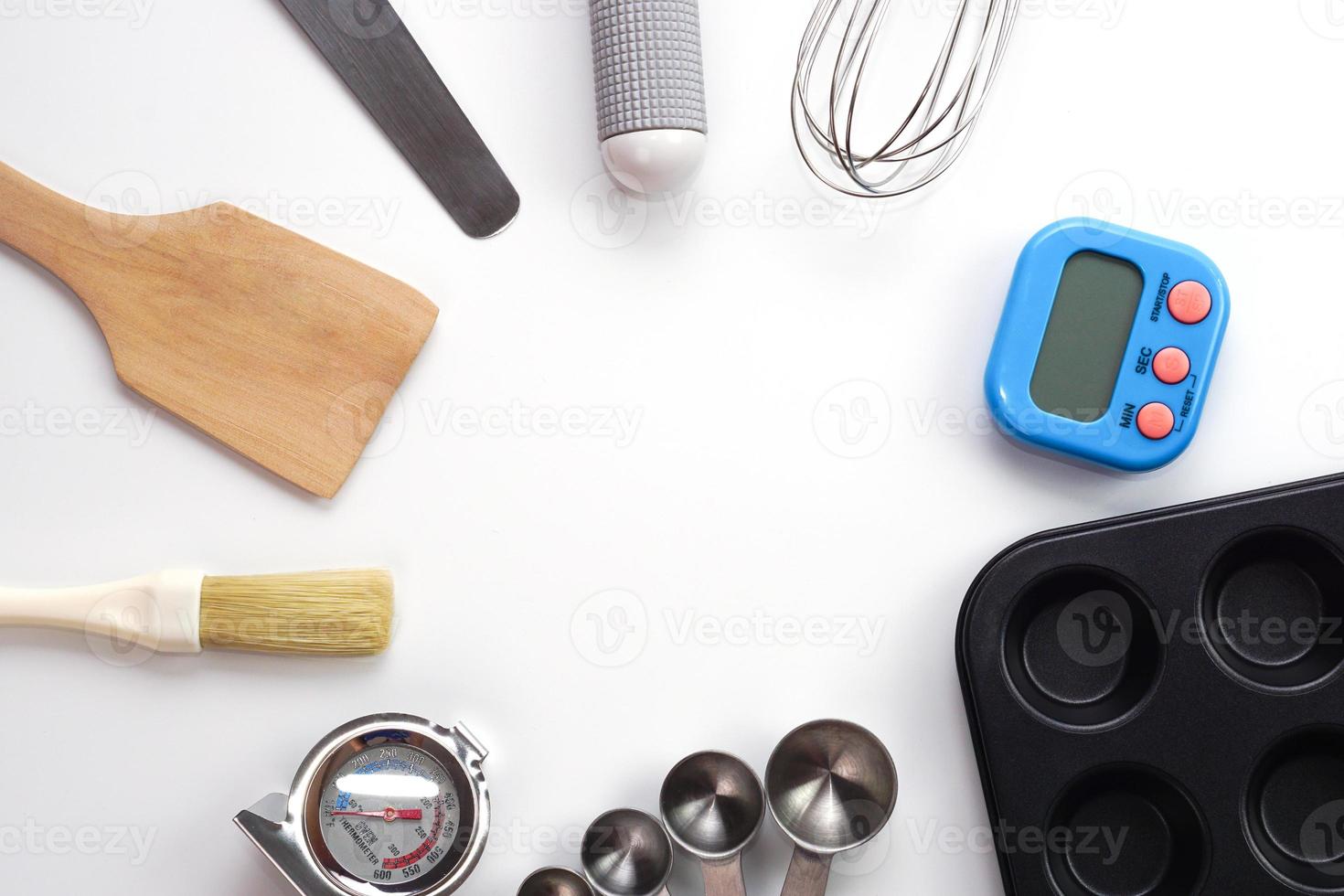 Top view set of kitchen utensils and ingredients for bakery on white background. Materials or kitchen equipment for bakery. photo