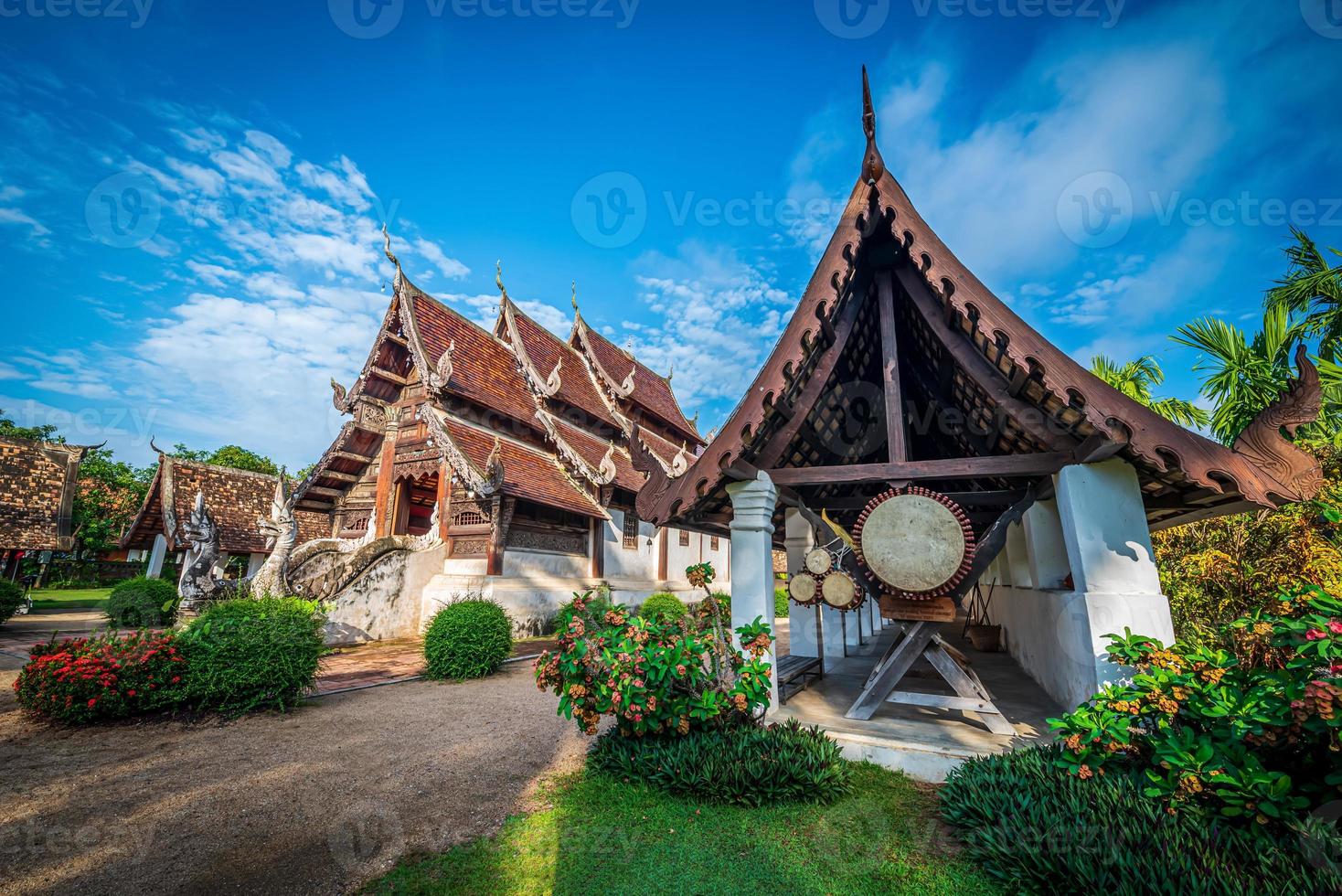 Old temple on blue sky with cloud in Chaing Mai, Thailand photo