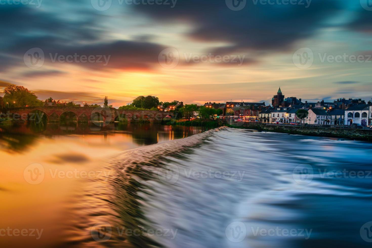 The River Nith and old bridge at sunset in Dumfries, Scotland. photo