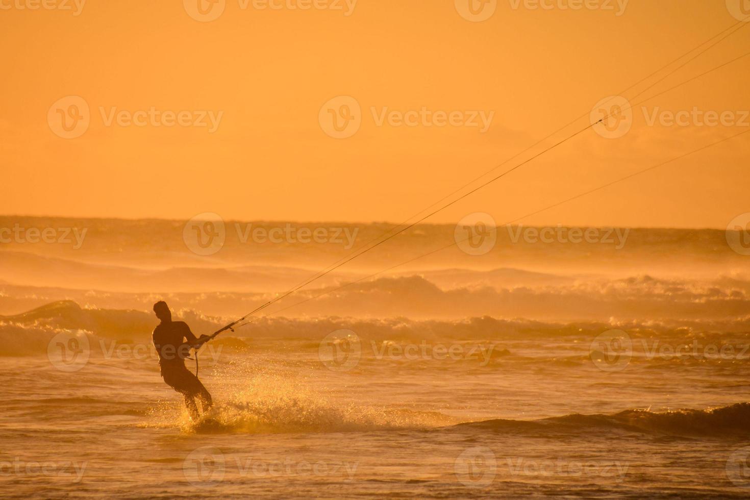 Kitesurfer at sunset photo