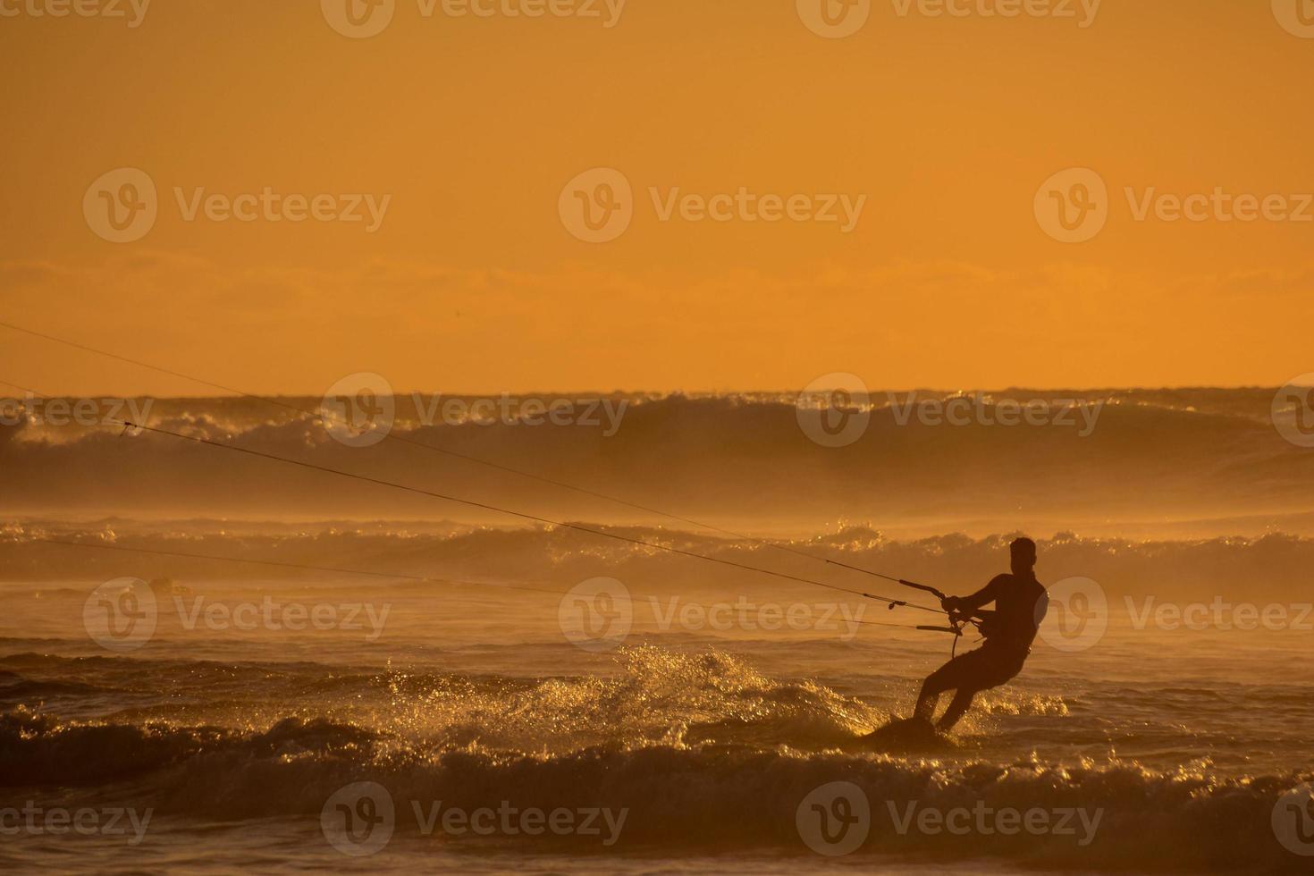 Kitesurfer at sunset photo