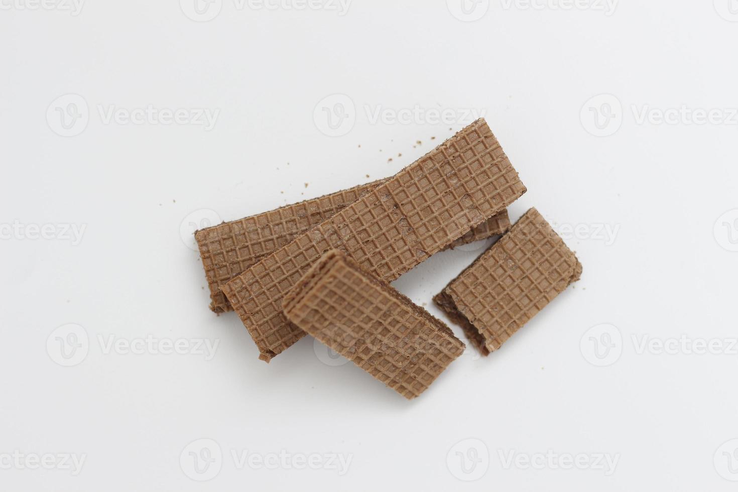 a close up of chocolate wafers isolated on white background. photo