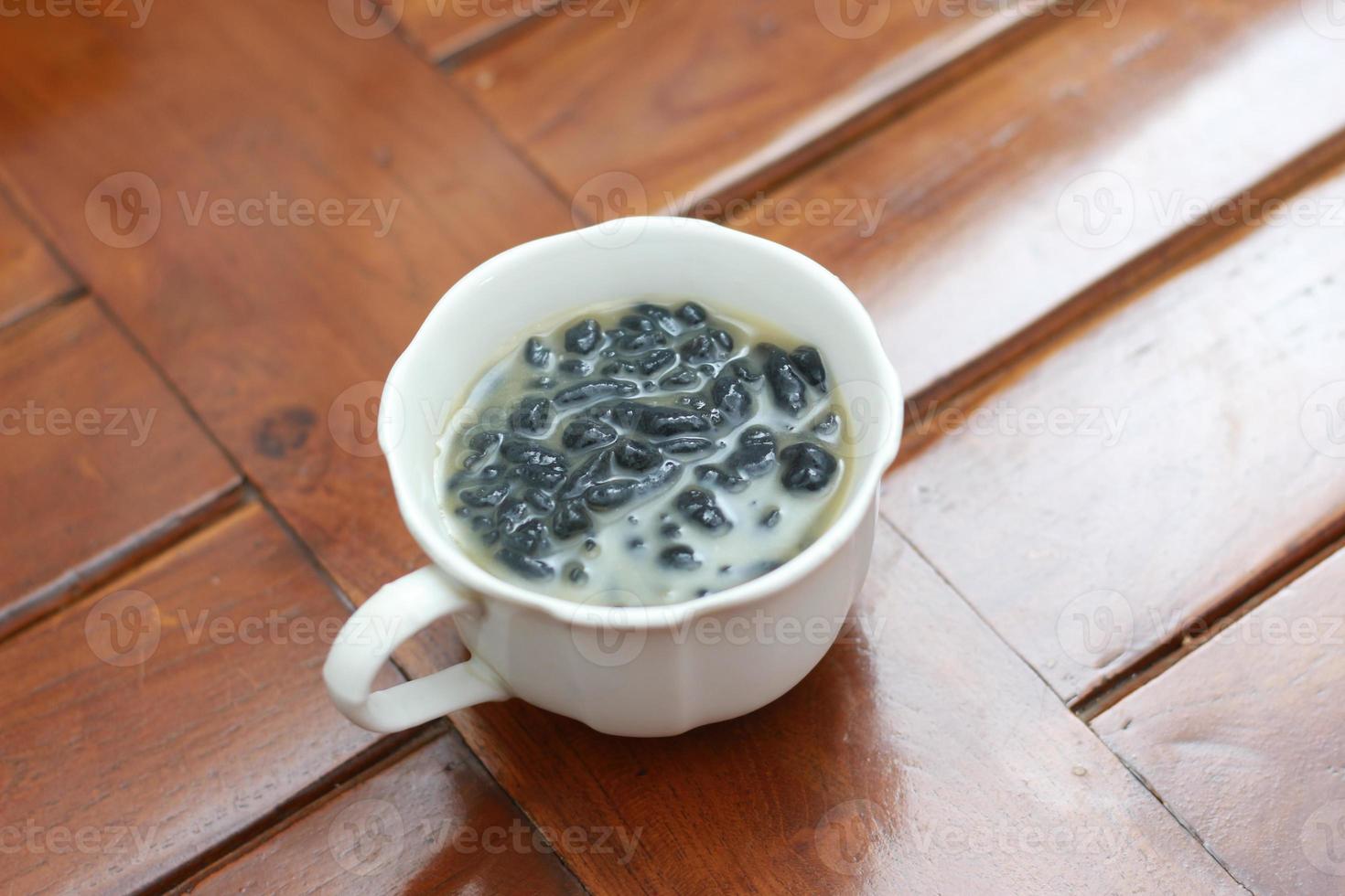 a close up of a glass of a traditional Indonesian drink called Dawet Ireng or black dawet. Indonesian traditional food photo concept.