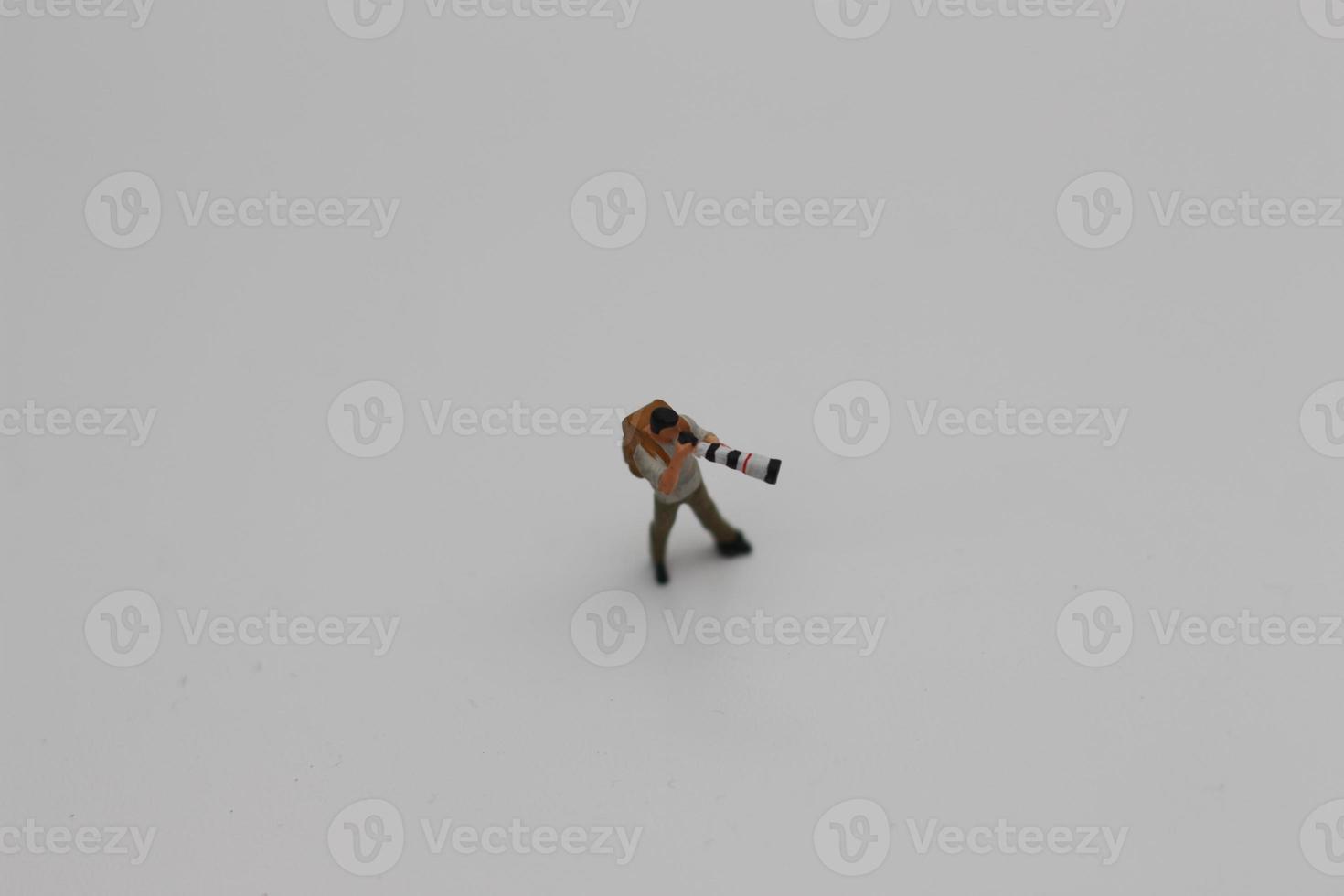 a close up of a miniature figure of a photographer photo