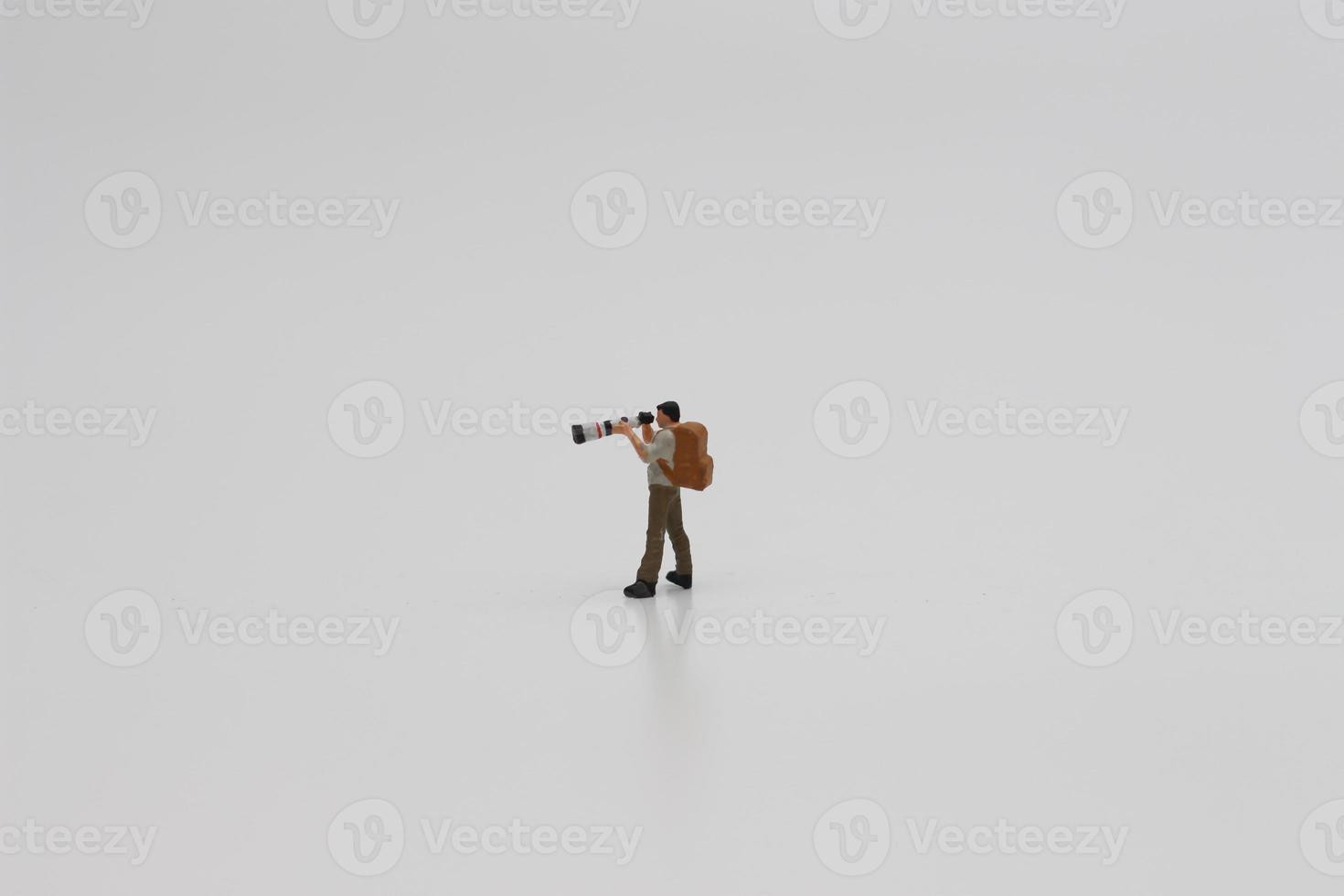 a close up of a miniature figure of a photographer photo