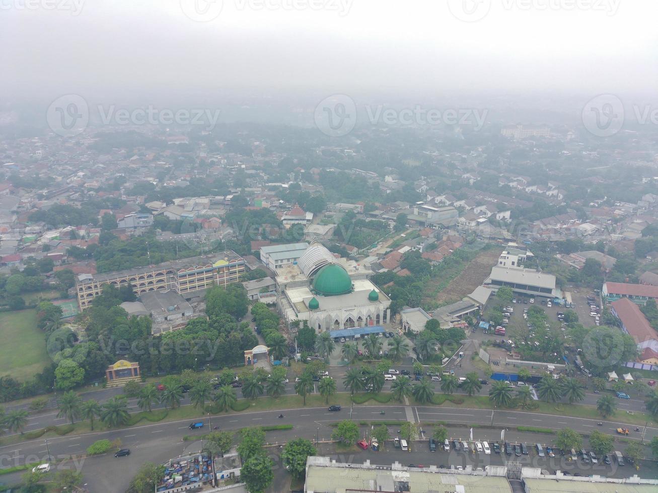 aerial view of the Darusalam mosque on the side of the highway. photo