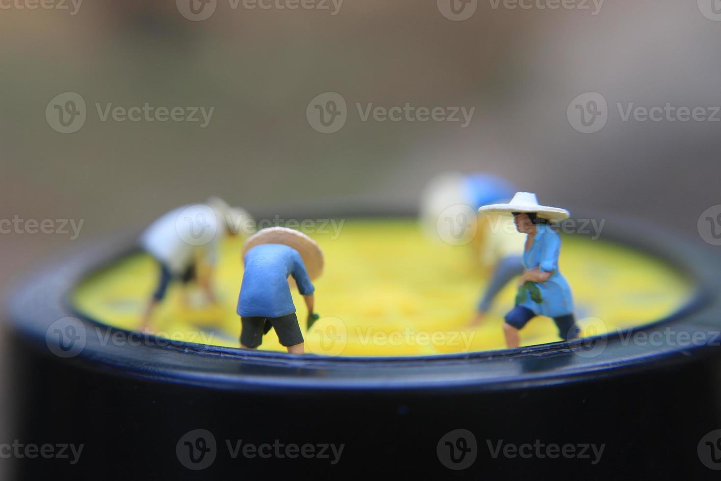 photo of a miniature figure with the concept of a farmer farming on a respirator.