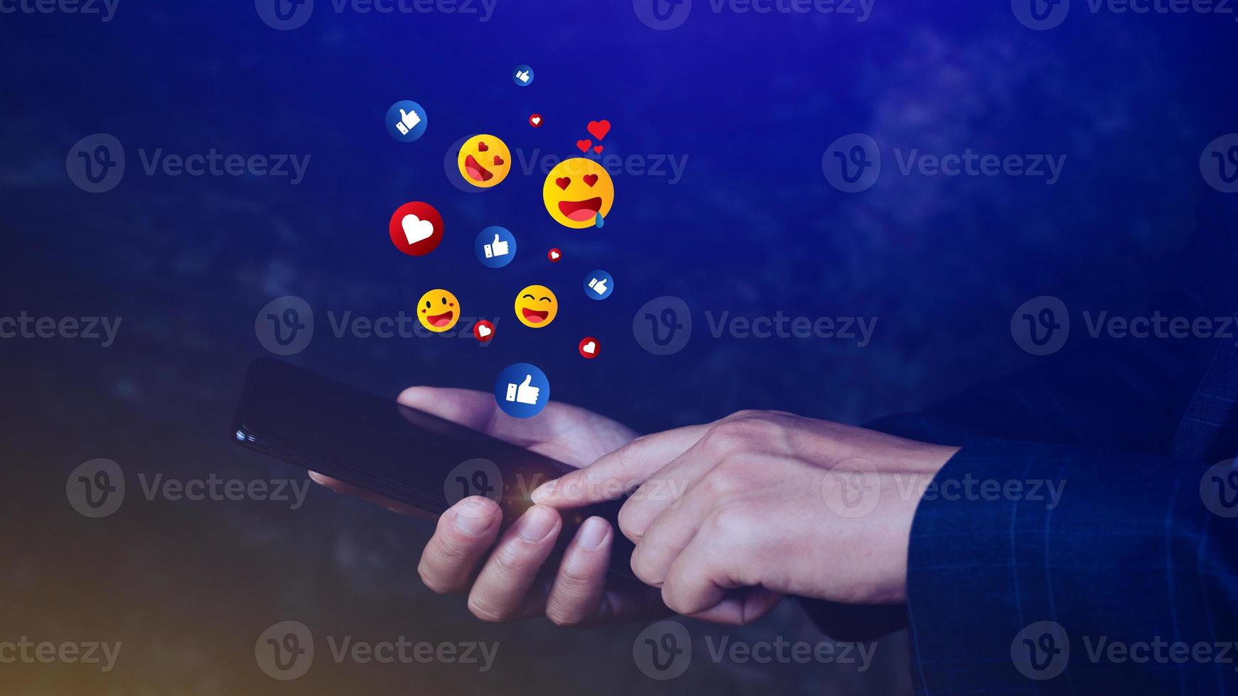 Social media and online digital concept, Businessman using smart phone sending emojis with social media. photo