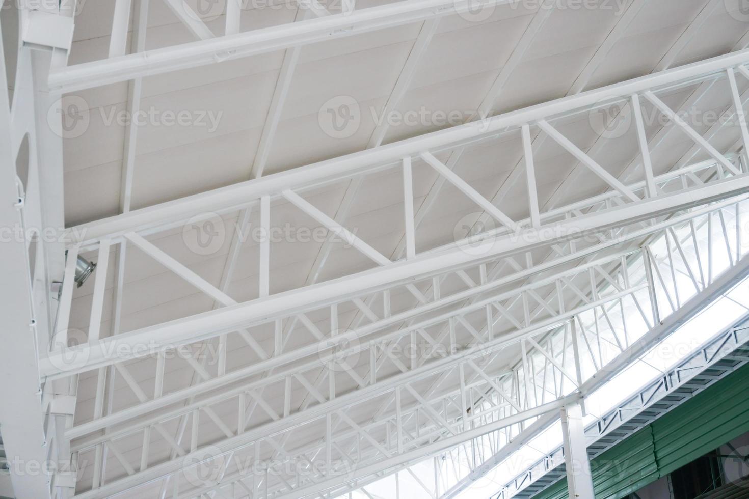 Large steel structure truss, roof frame and metal sheet in building construction site photo