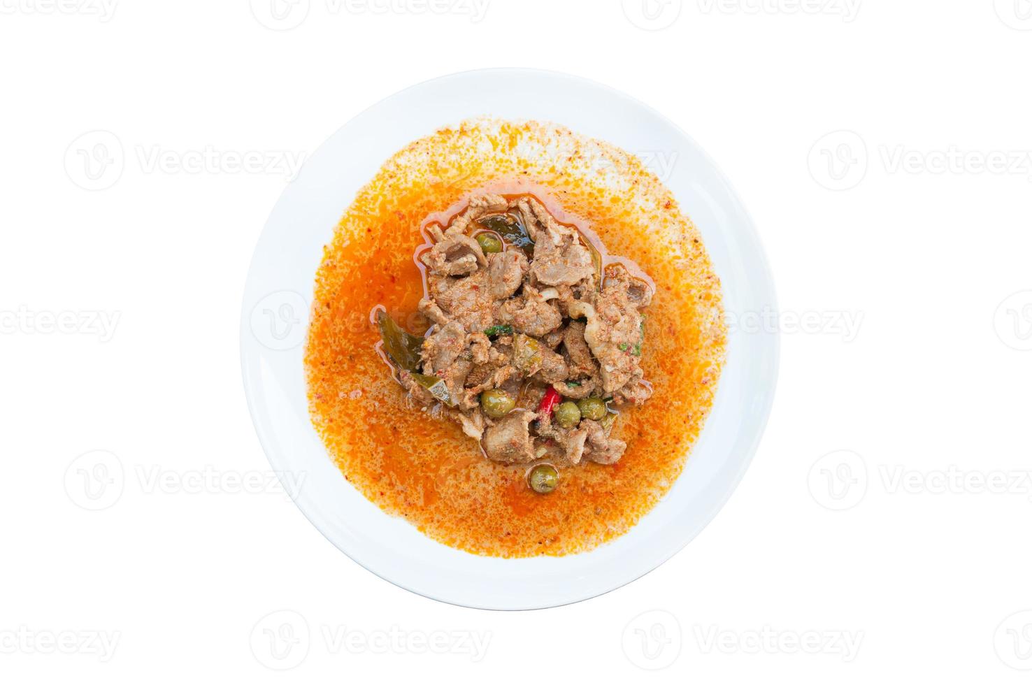 Red curry with pork and coconut milk Panaeng on white dish isolated on white background  delicious and famous thailand food photo