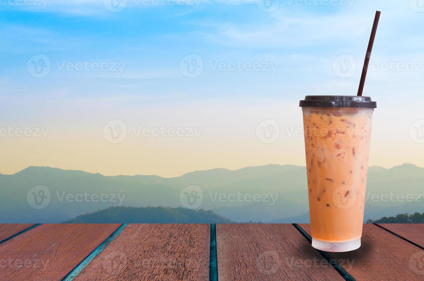 iced milk tea on nature background ,Summer drinks with ice photo