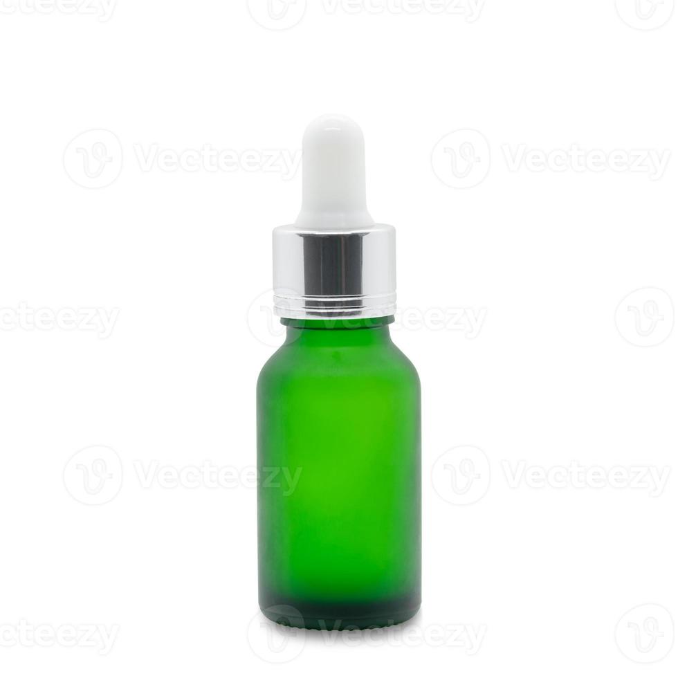 Green dropper serum bottle on white photo