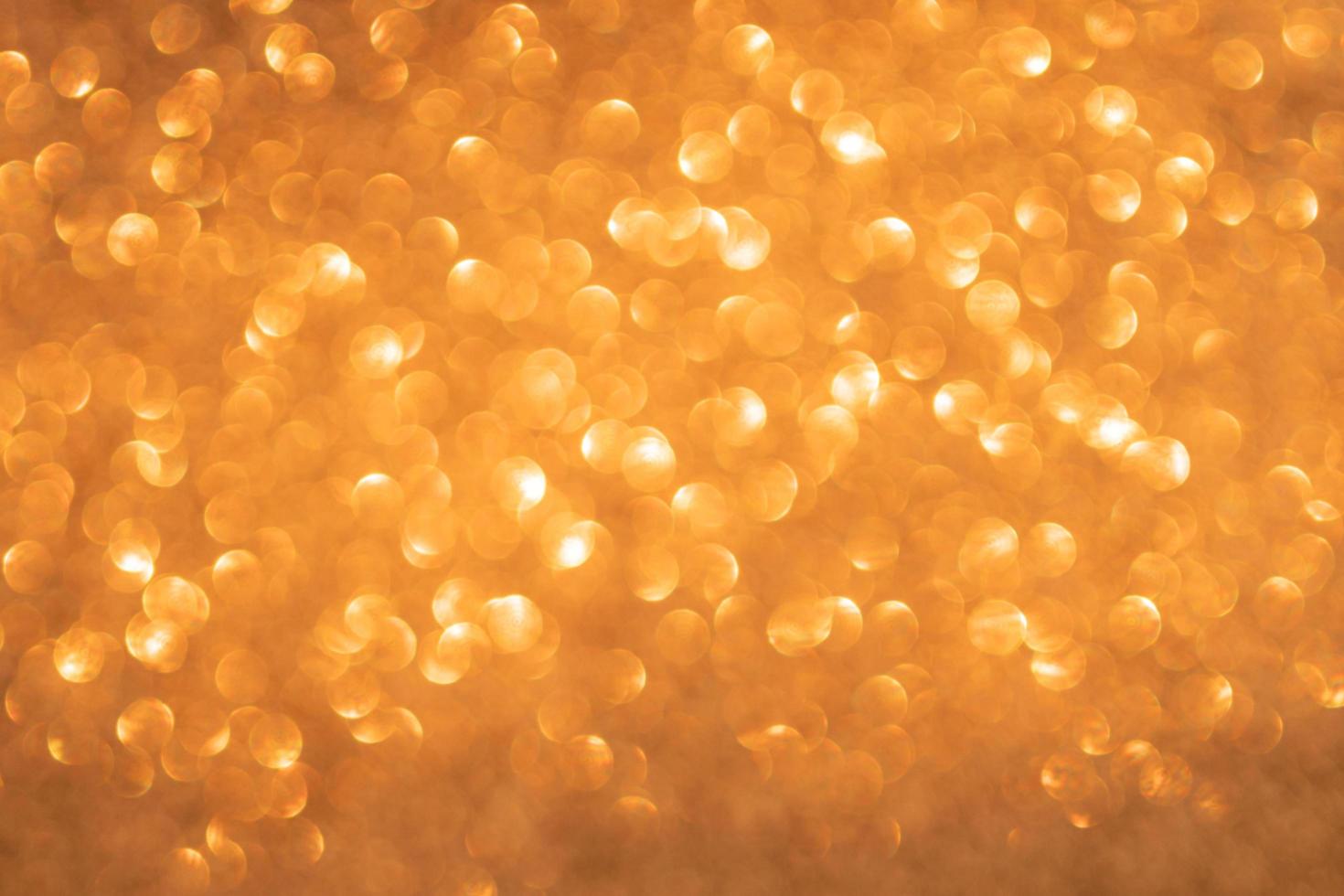 Orange bokeh and defocused background with copy space photo