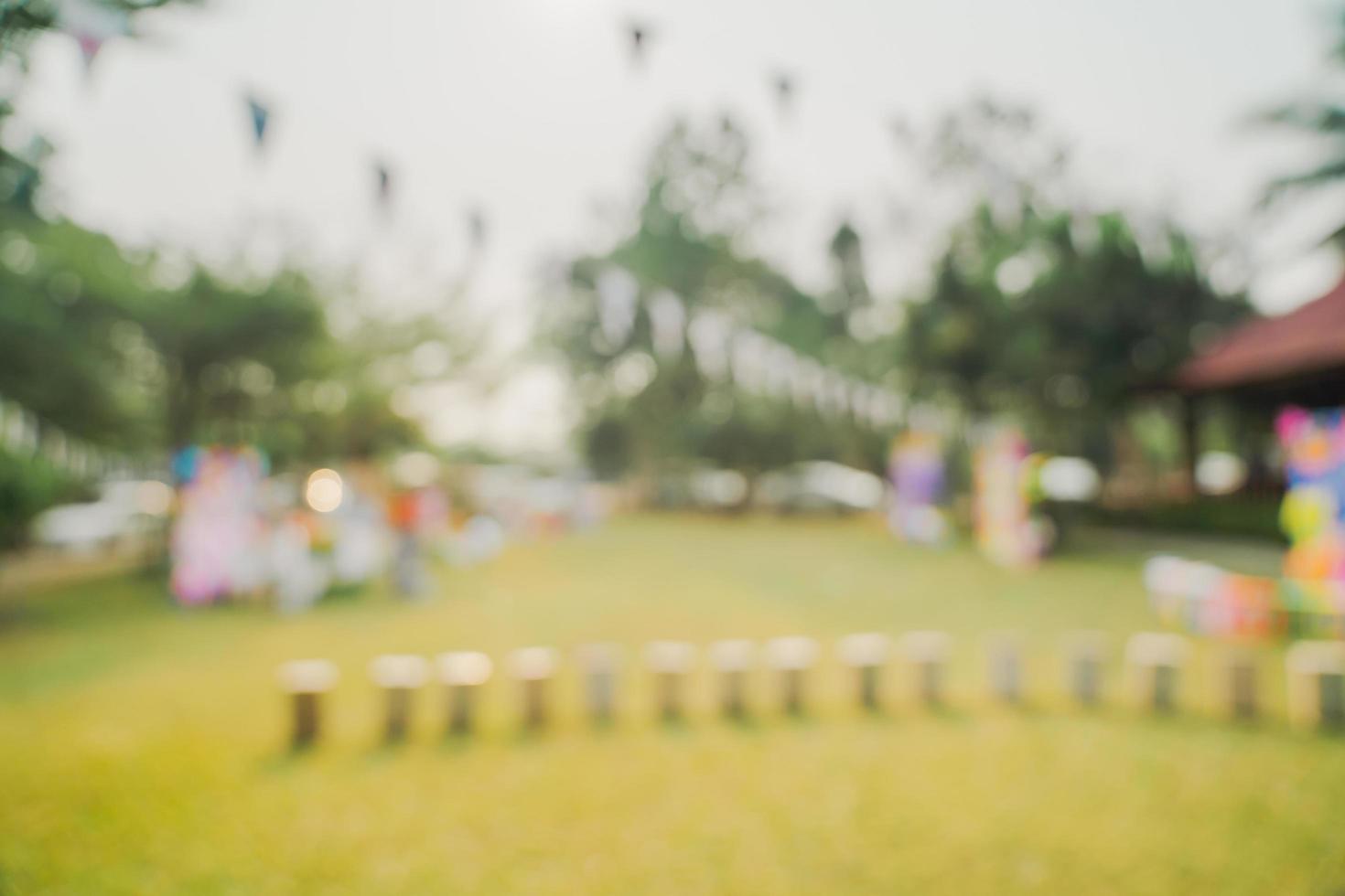 defocused bokeh and blur background of garden trees in sunlight with vintage toned. photo