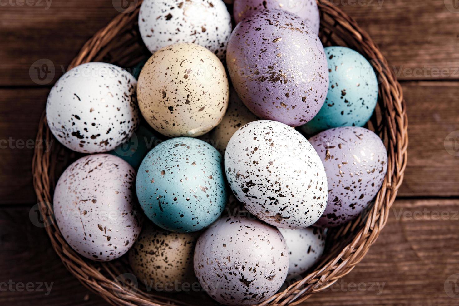 Pastel Easter eggs background. Spring greating card. Easter eggs in basket photo