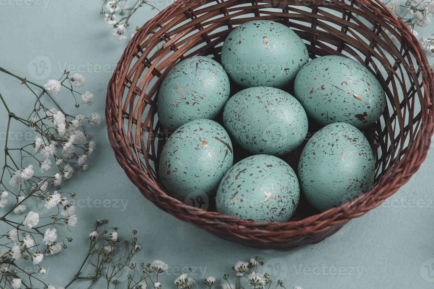 Pastel Easter eggs background. Spring greating card. Easter eggs in basket photo