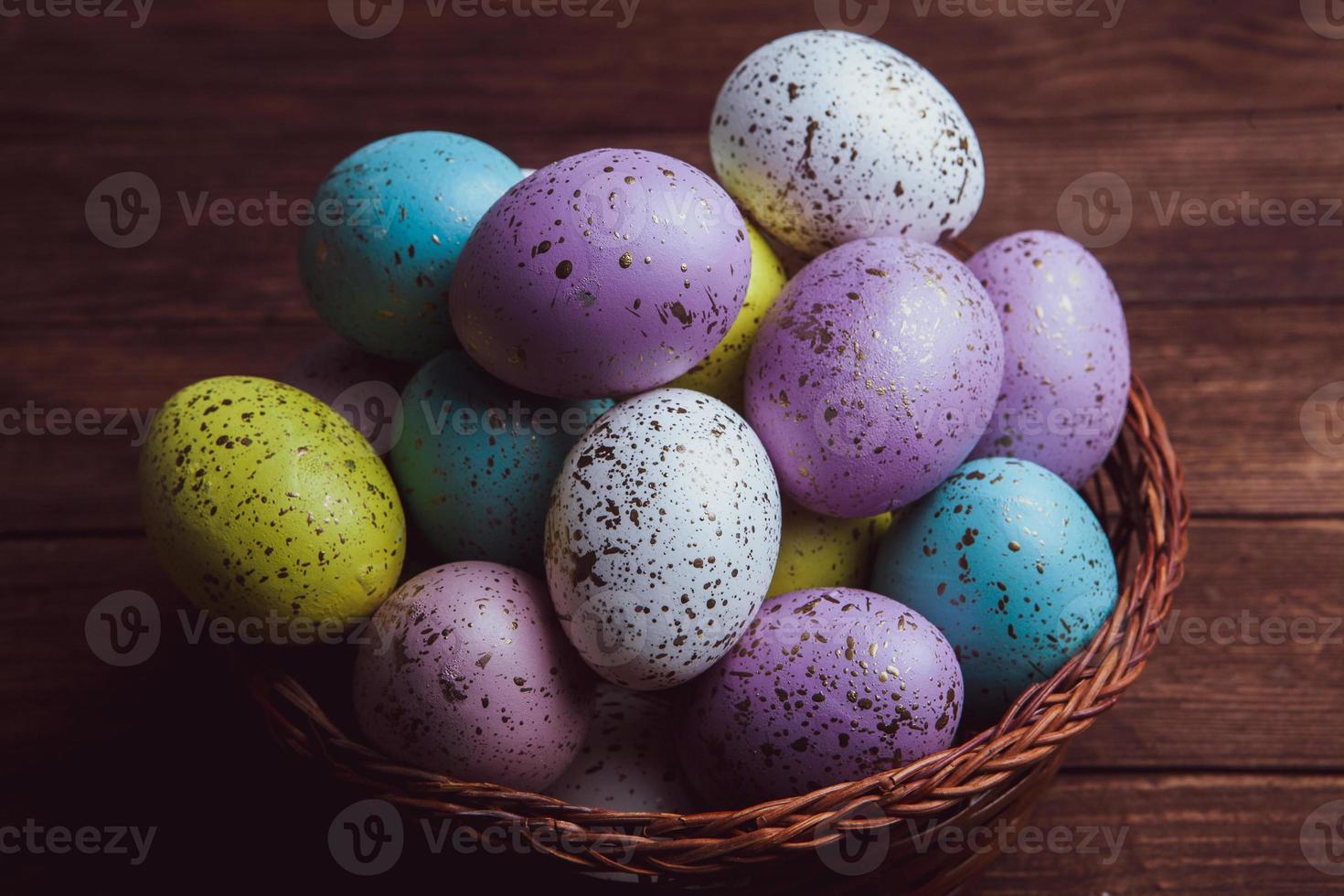 Pastel Easter eggs background. Spring greating card. Easter eggs in basket photo