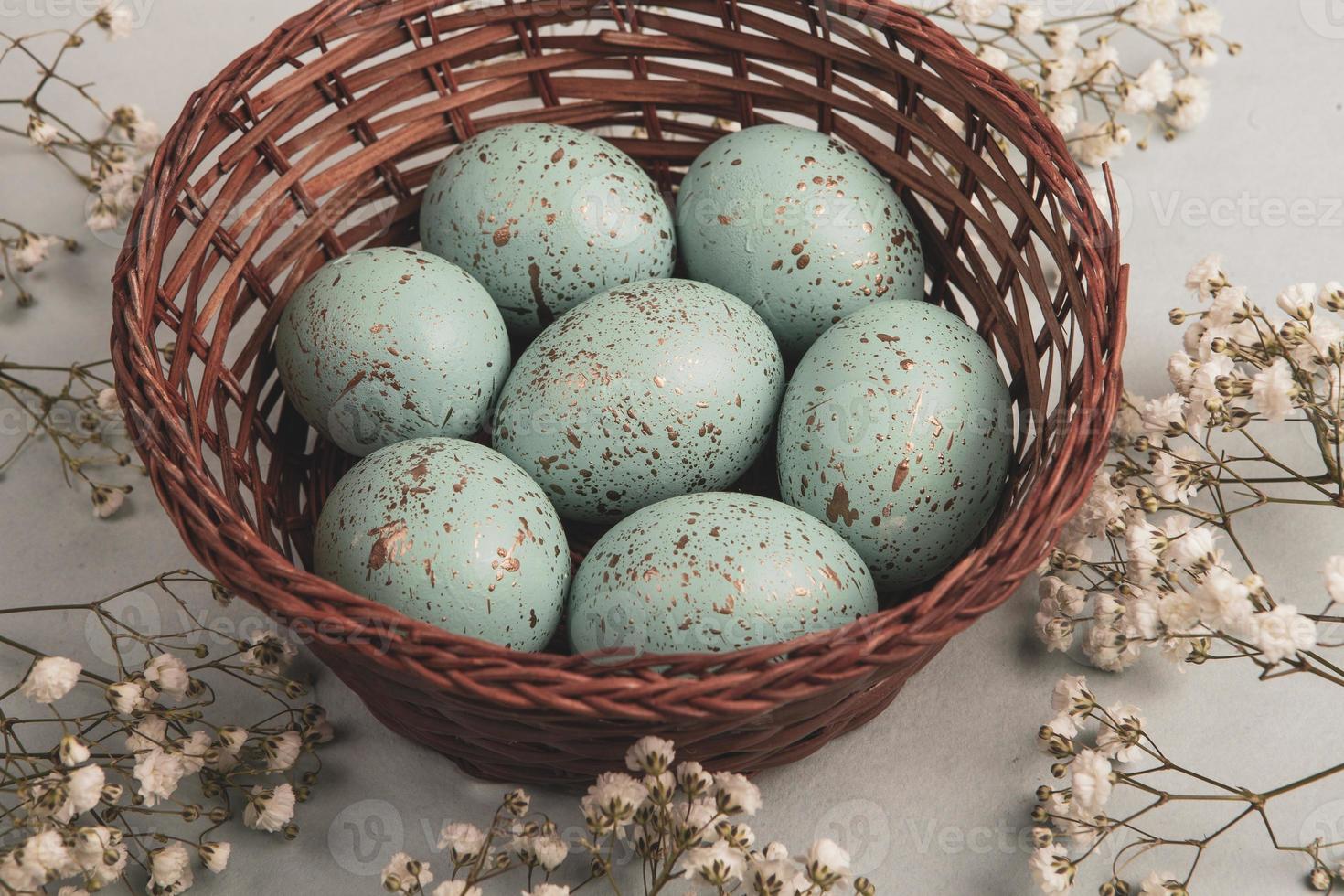 Pastel Easter eggs background. Spring greating card. Easter eggs in basket photo