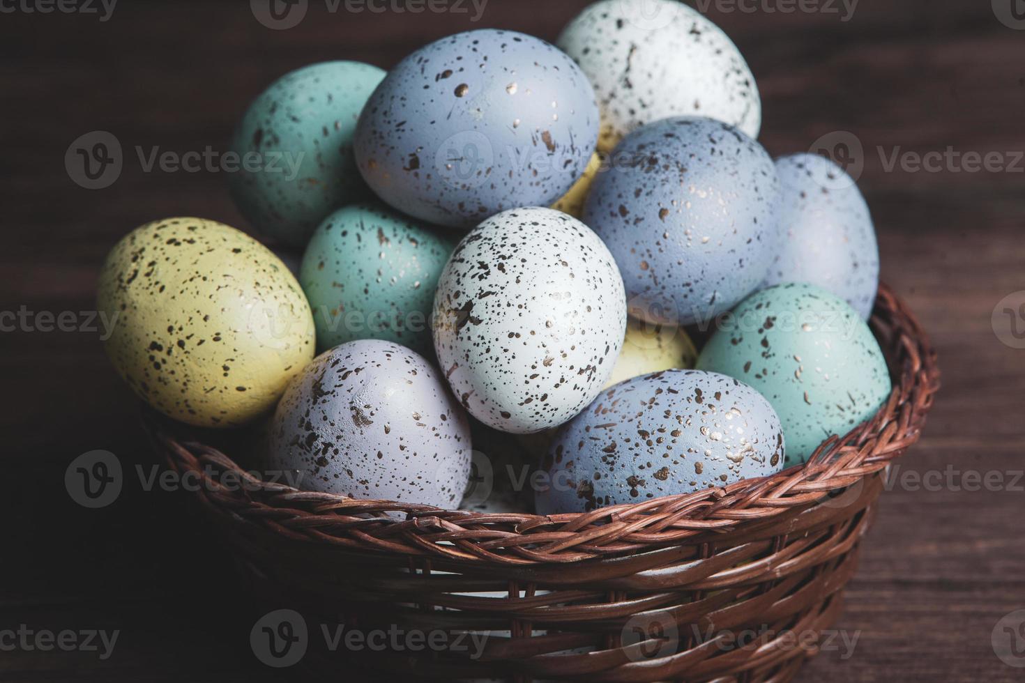 Pastel Easter eggs background. Spring greating card. Easter eggs in basket photo