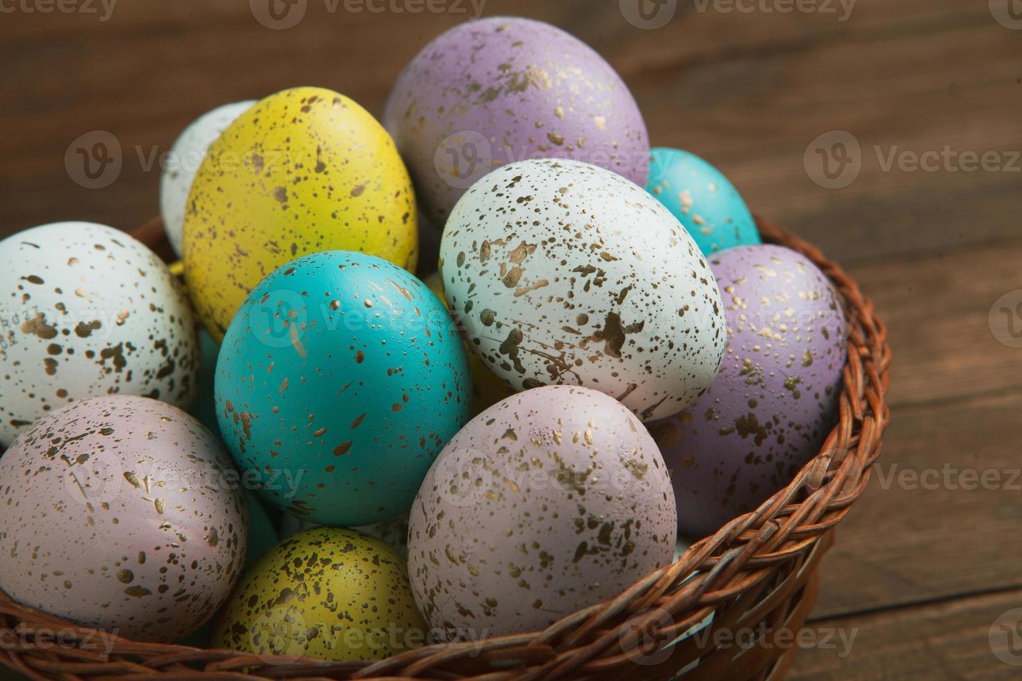 Pastel Easter eggs background. Spring greating card. Easter eggs in basket photo