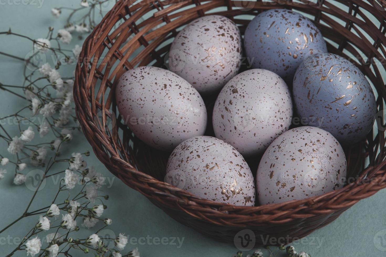 Pastel Easter eggs background. Spring greating card. Easter eggs in basket photo