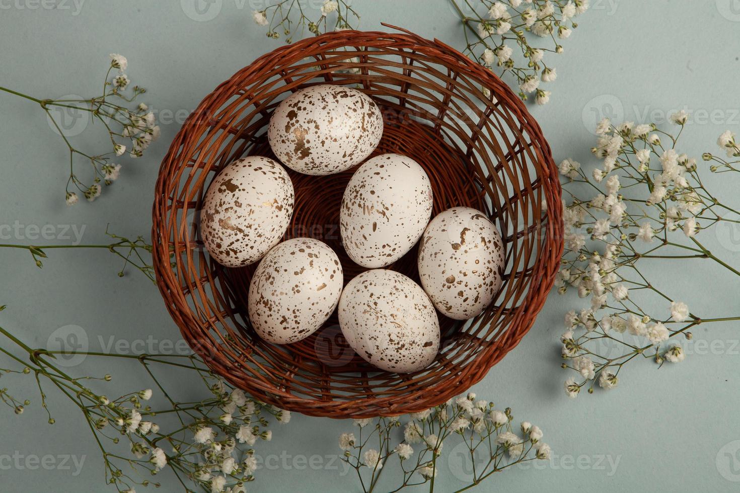 Pastel Easter eggs background. Spring greating card. Easter eggs in basket photo
