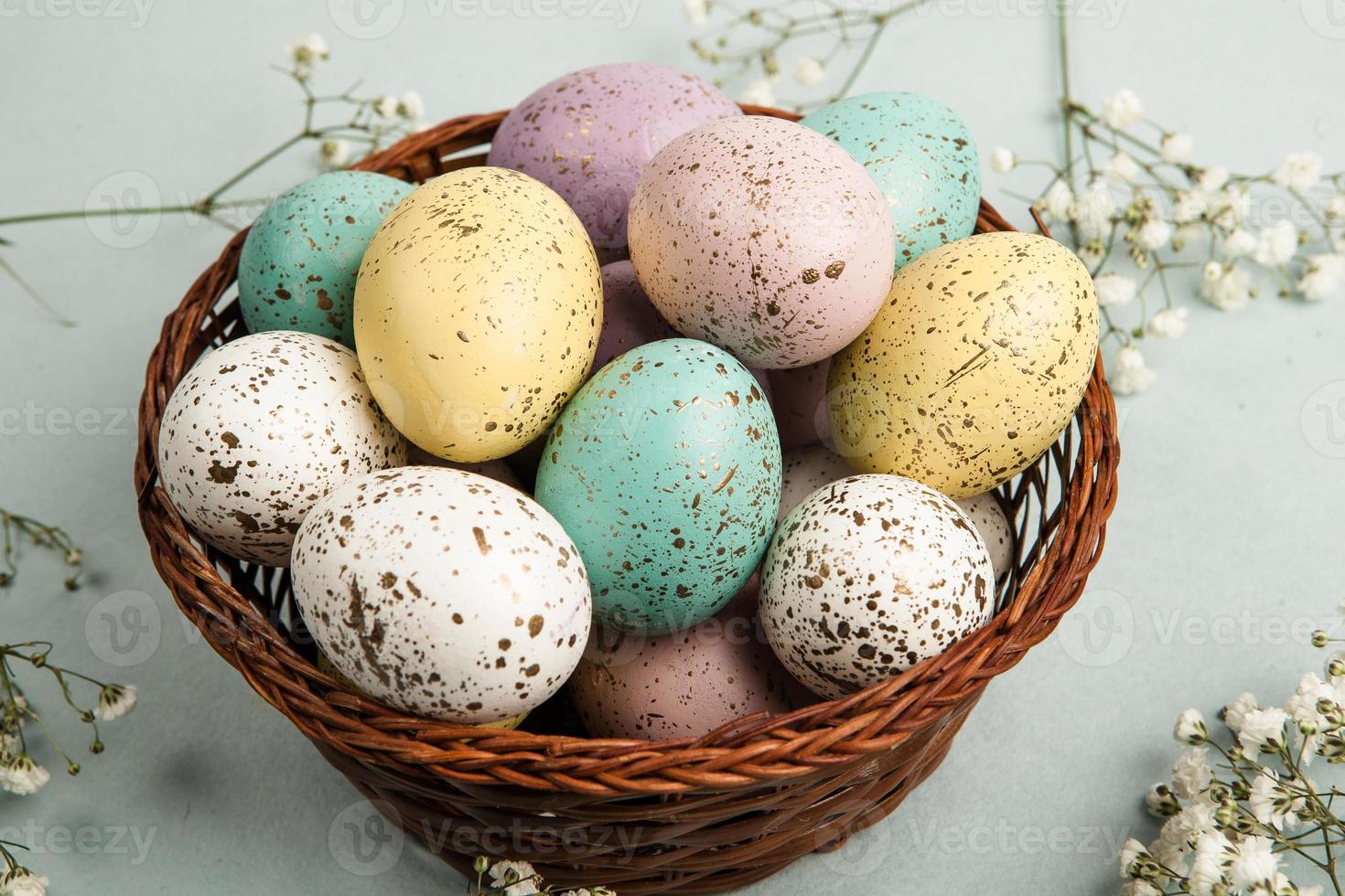 Pastel Easter eggs background. Spring greating card. Easter eggs in basket photo