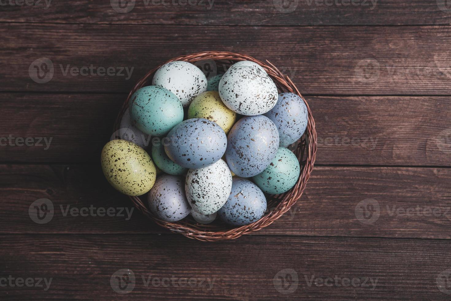 Pastel Easter eggs background. Spring greating card. Easter eggs in basket photo