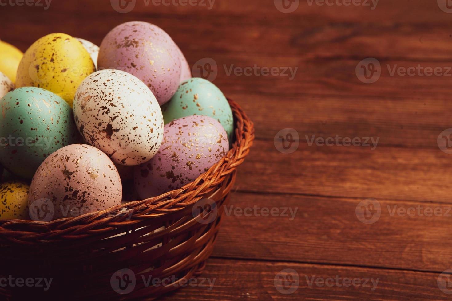Pastel Easter eggs background. Spring greating card. Easter eggs in basket photo