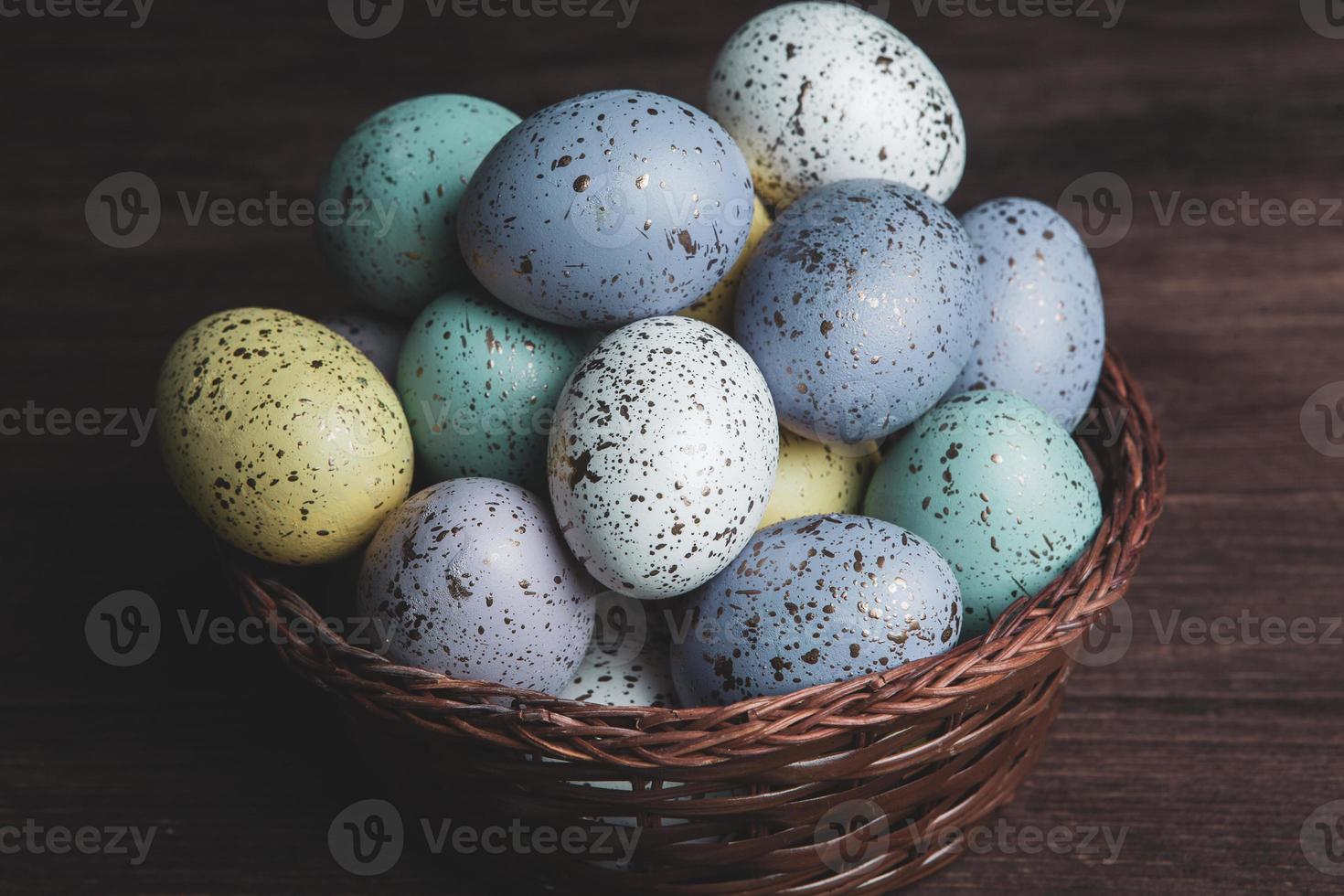 Pastel Easter eggs background. Spring greating card. Easter eggs in basket photo