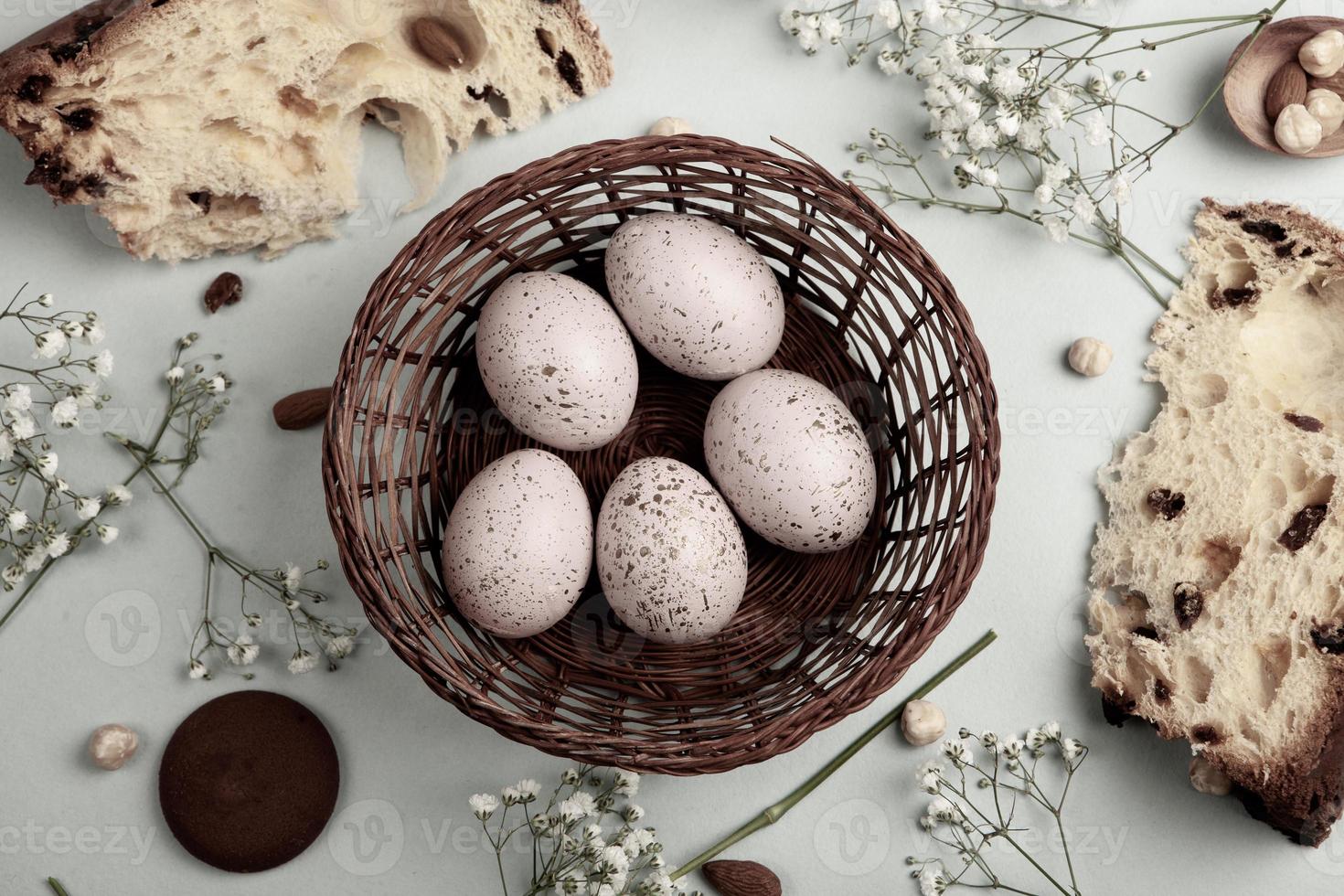 Pastel Easter eggs background. Spring greating card. Easter eggs in basket photo
