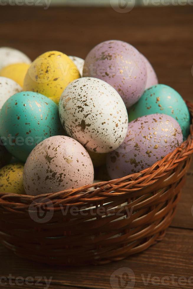 Pastel Easter eggs background. Spring greating card. Easter eggs in basket photo