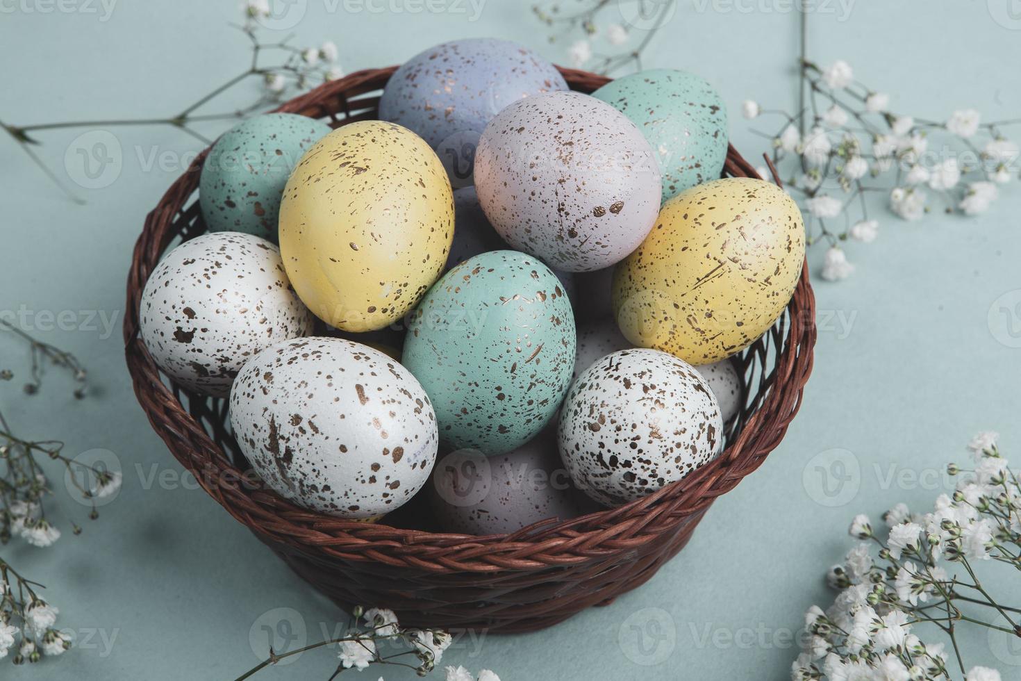 Pastel Easter eggs background. Spring greating card. Easter eggs in basket photo