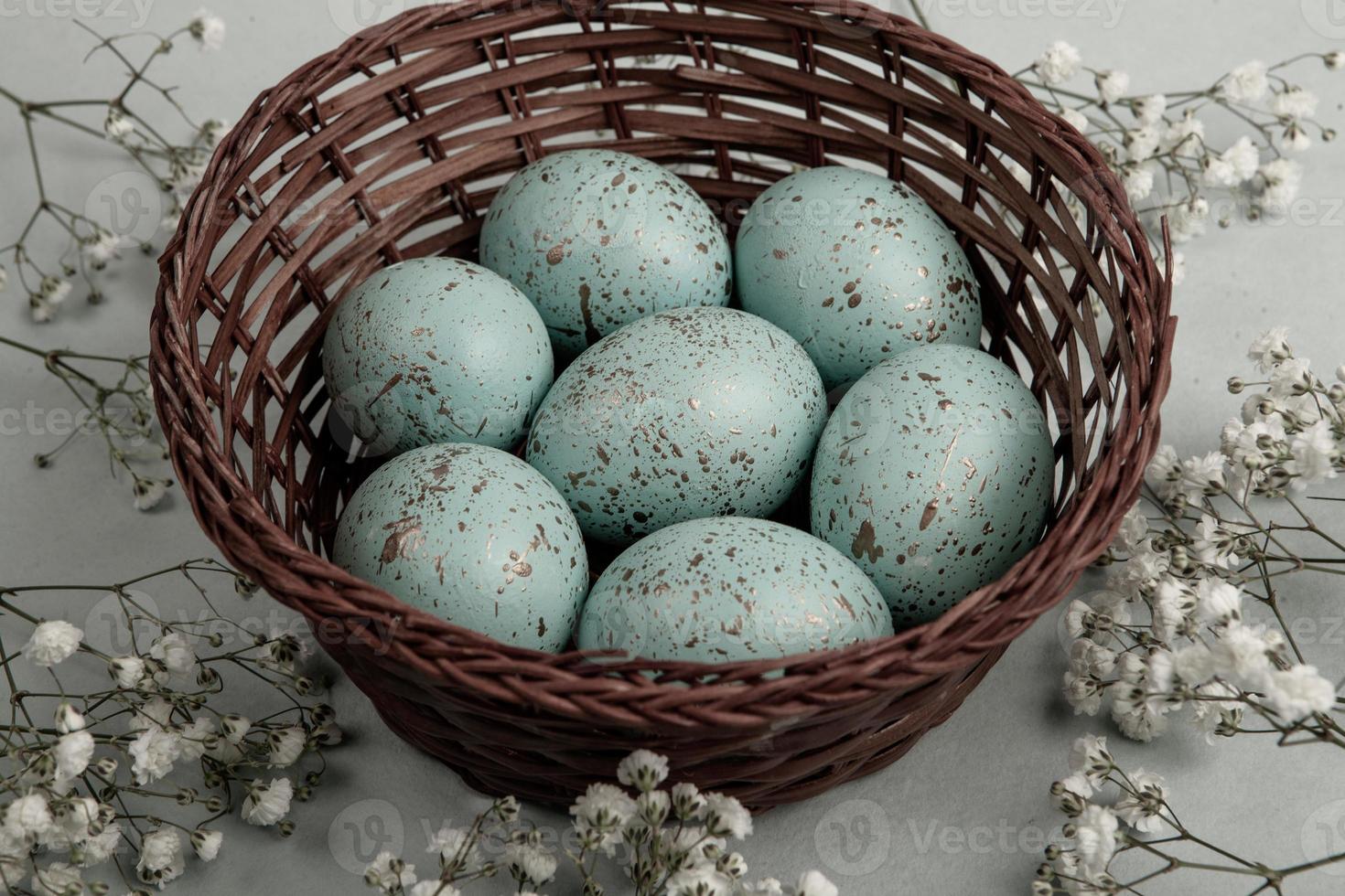 Pastel Easter eggs background. Spring greating card. Easter eggs in basket photo