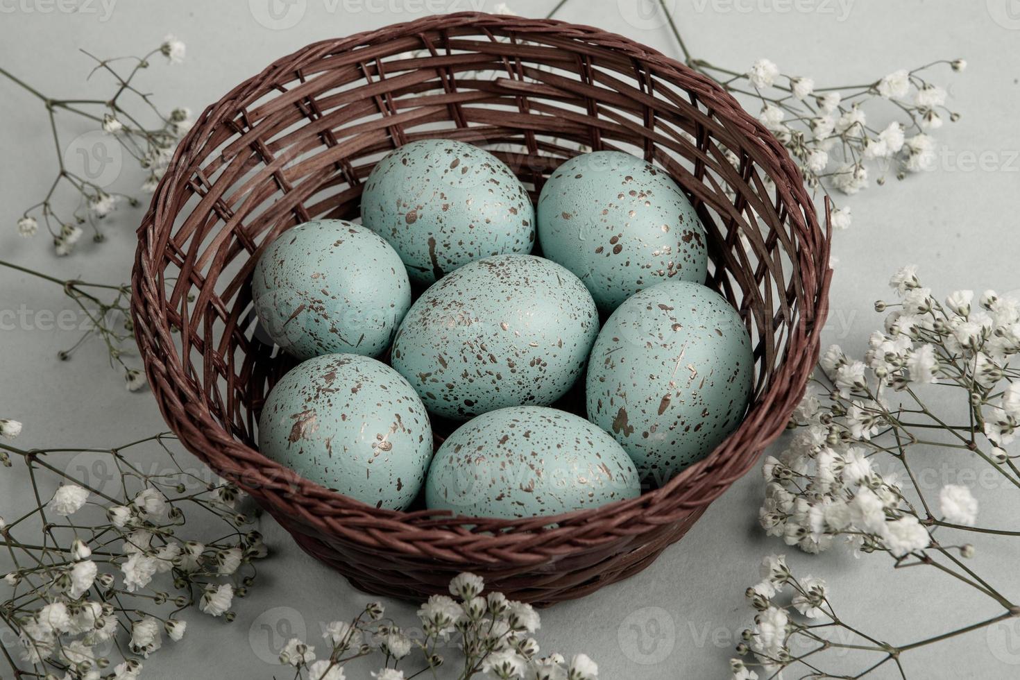 Pastel Easter eggs background. Spring greating card. Easter eggs in basket photo