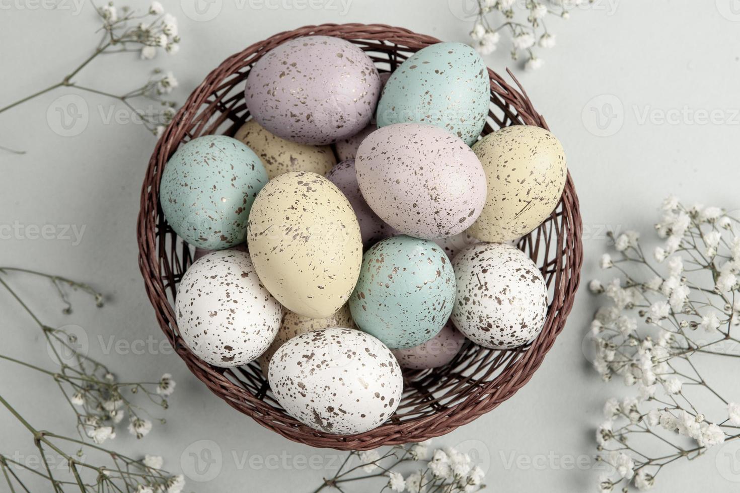 Pastel Easter eggs background. Spring greating card. Easter eggs in basket photo