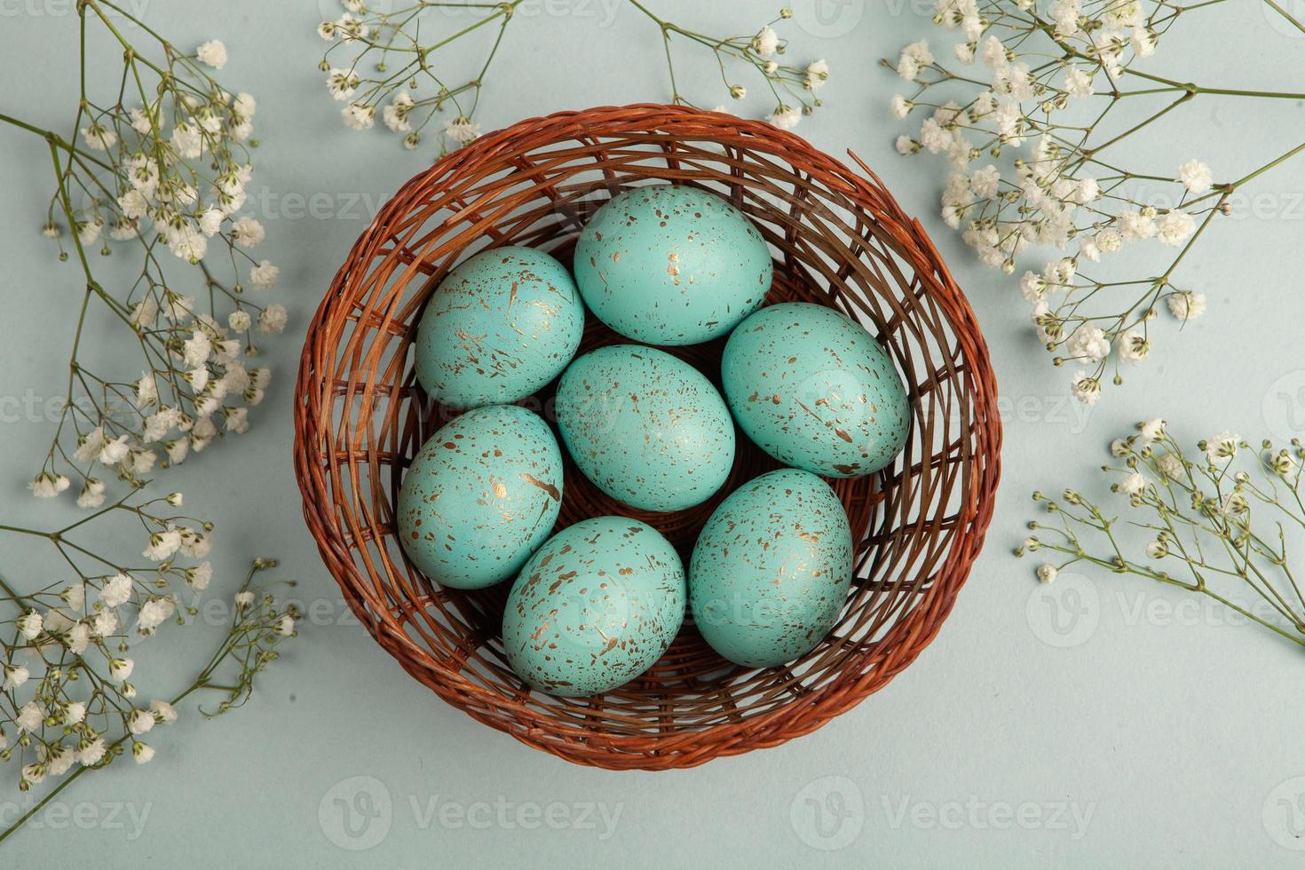 Pastel Easter eggs background. Spring greating card. Easter eggs in basket photo