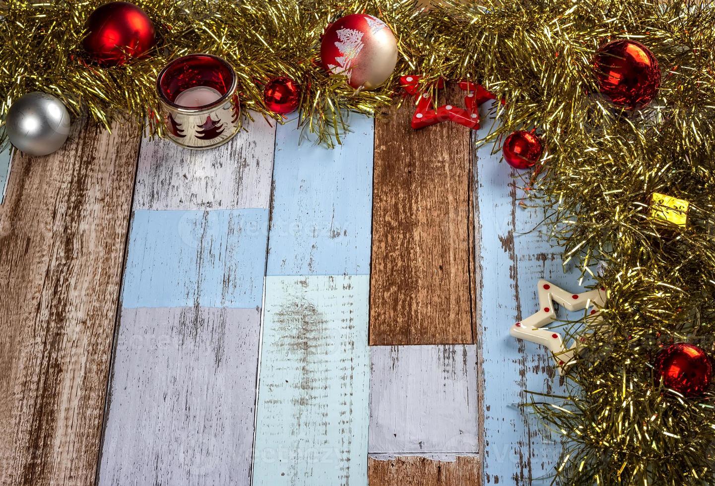 Christmas background with garlands and toys on a wooden canvas background. Merry Christmas card. photo