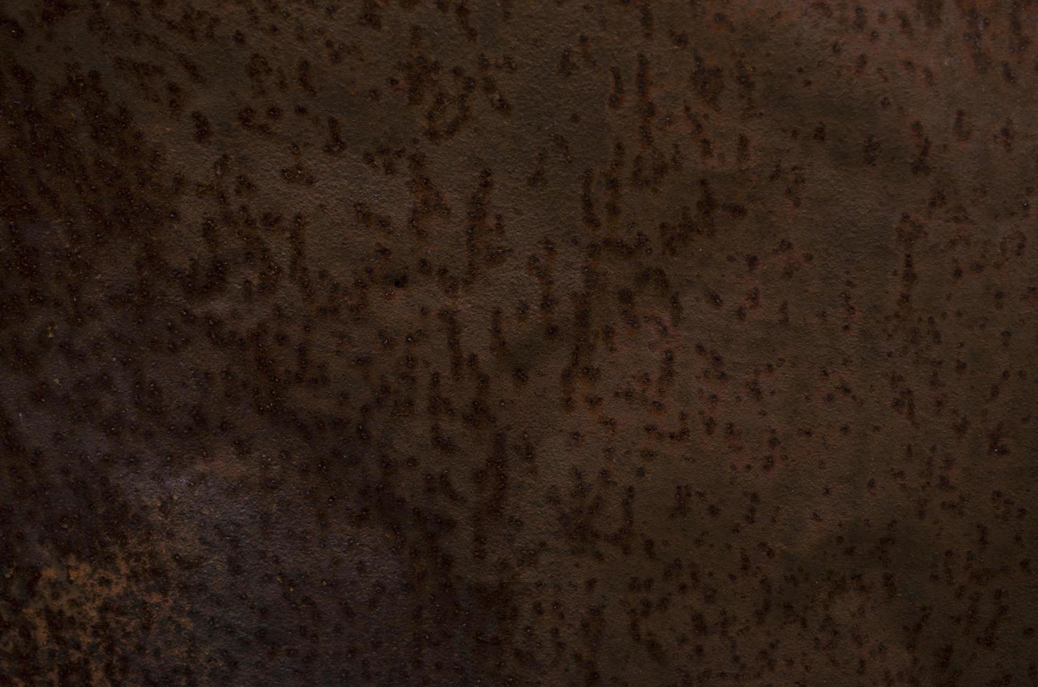 Rust and oxidized background. Old iron panel. Dark red, brown and black rust on the metal plate. Grunge rusted metal abstract texture. Rusted metal wall. Rusty metal surface with streaks of rust. photo