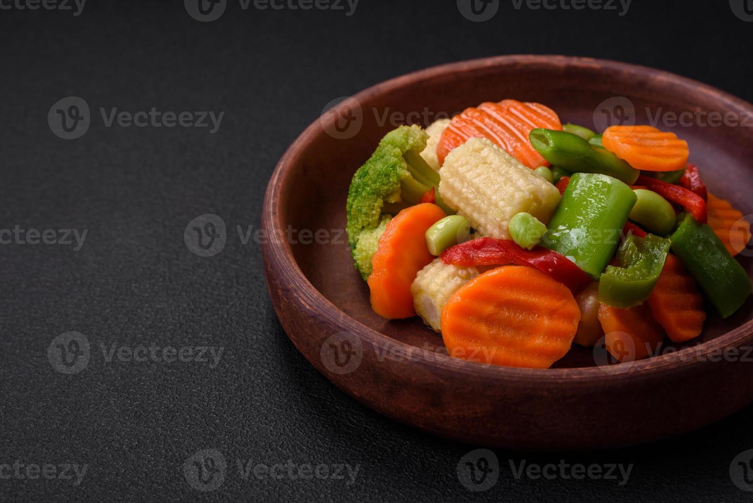 Delicious healthy vegetables steamed carrots, broccoli, asparagus beans photo
