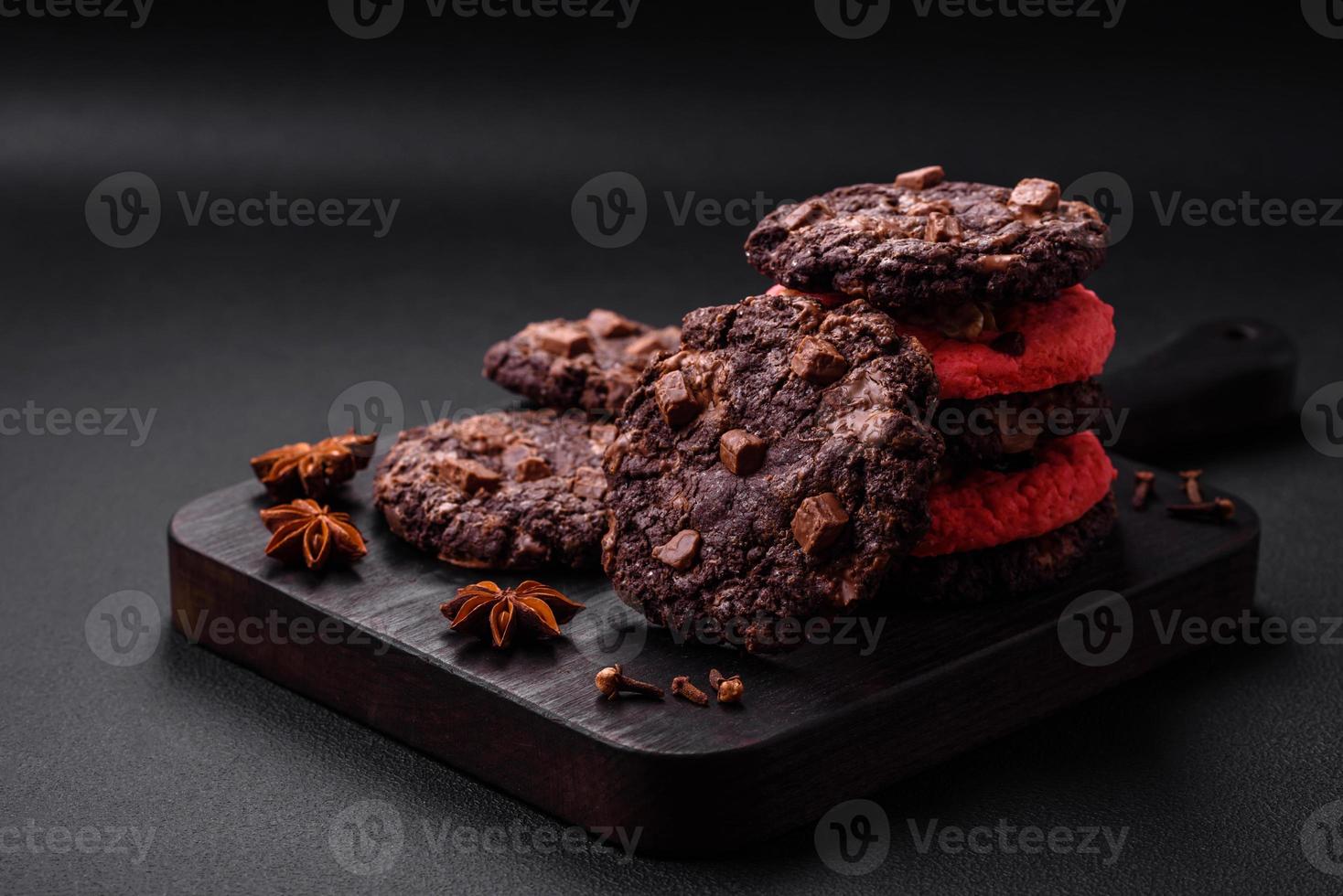 Delicious fresh crispy oatmeal cookies with chocolate and nuts photo