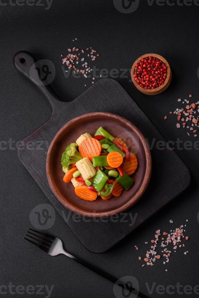 Delicious healthy vegetables steamed carrots, broccoli, asparagus beans photo