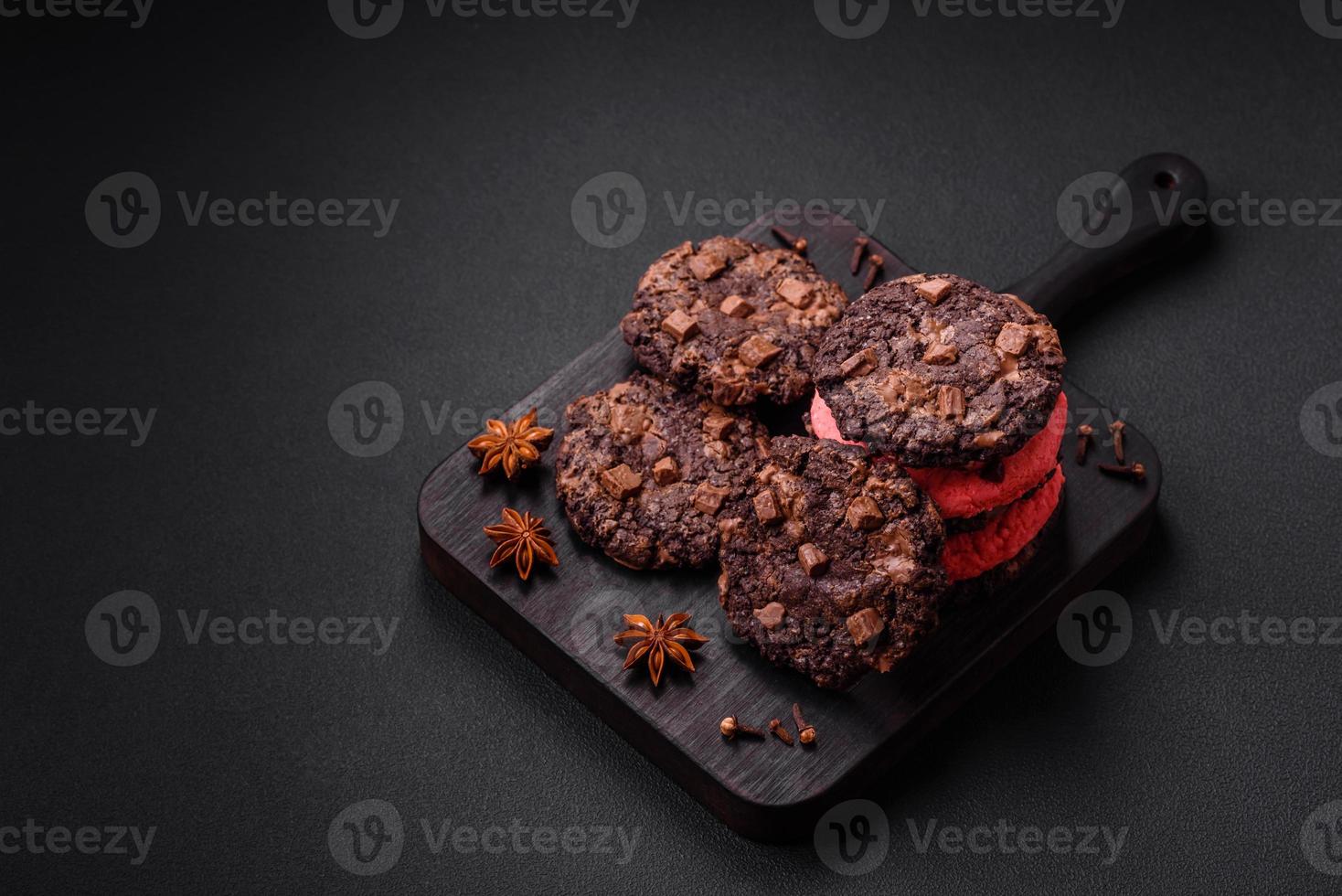 Delicious fresh crispy oatmeal cookies with chocolate and nuts photo