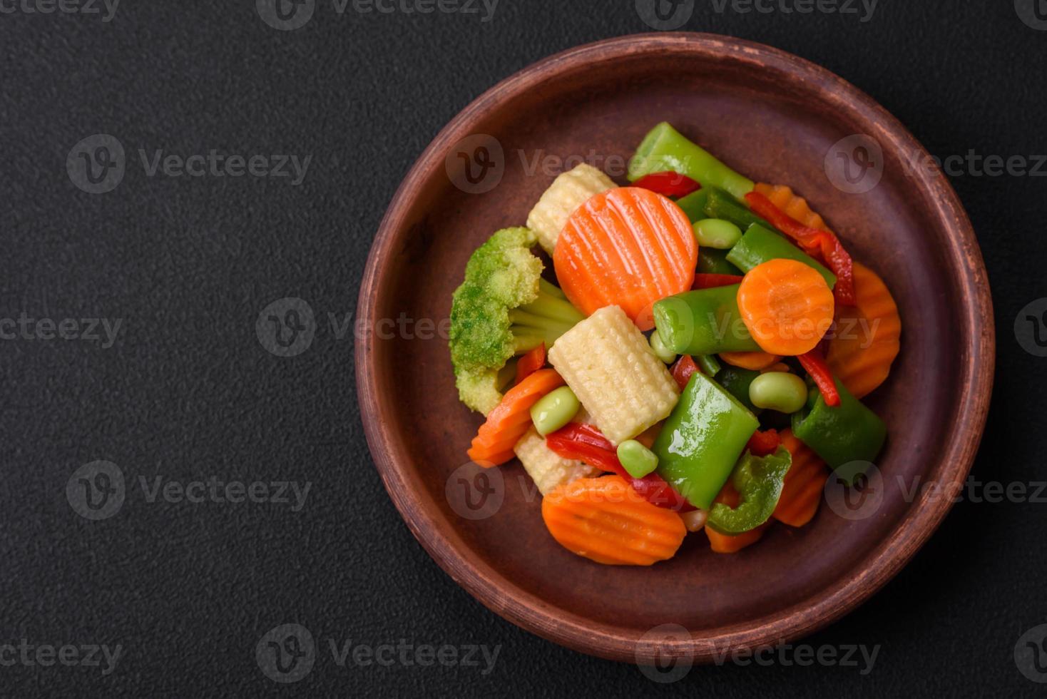 Delicious healthy vegetables steamed carrots, broccoli, asparagus beans photo