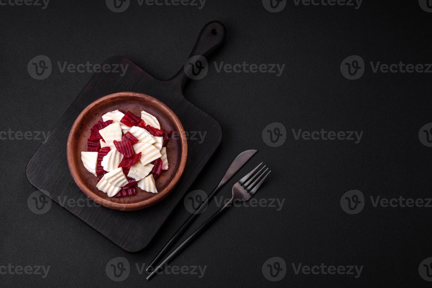 Delicious fresh mozzarella and boiled beets cut into slices photo